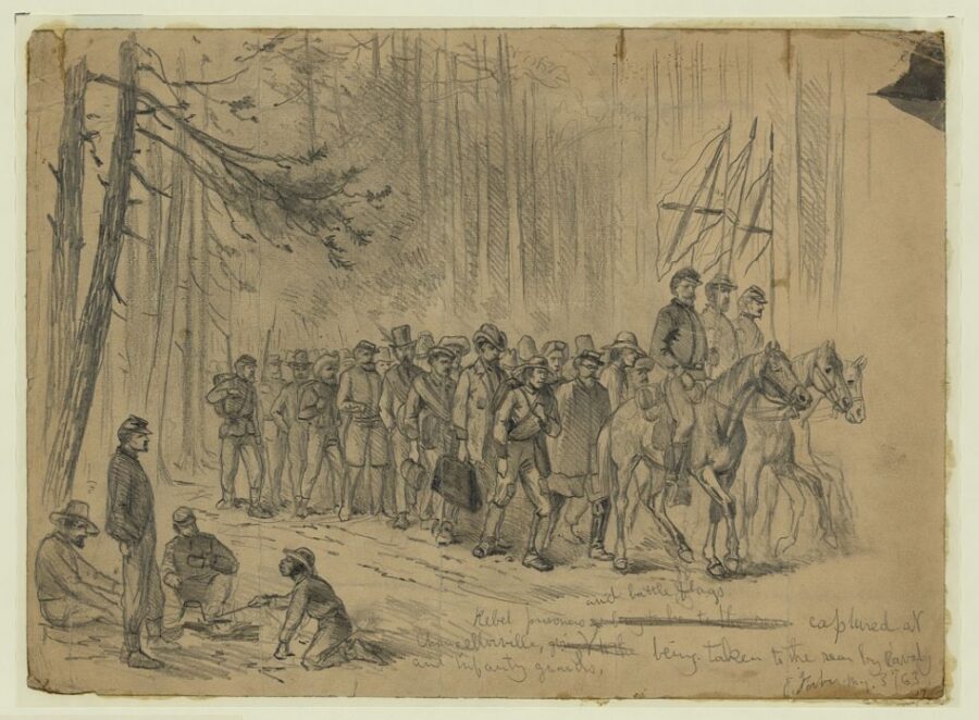 Union soldiers march Confederate prisoners, and captured battle flags, toward the rear on May 3. While the battle was a decisive Confederate victory, some 2,000 of Lee’s men were captured during the engagement. 