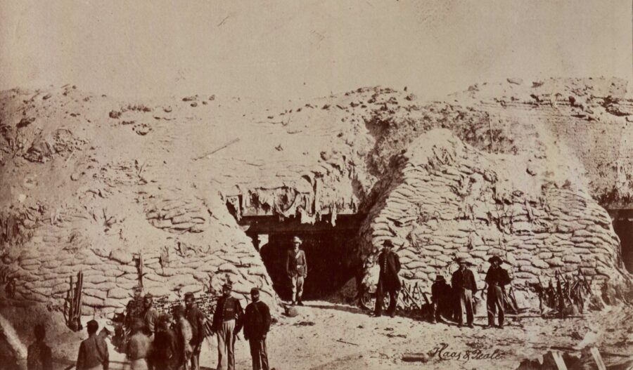 Union troops—including some from the 54th Massachusettes—tour the inside of Fort Wagner after Union forces captured it. (USAHEC)