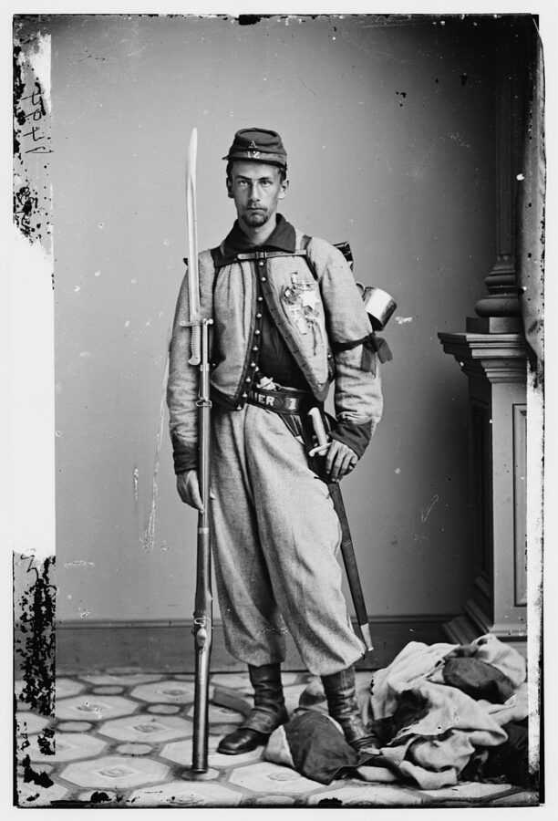 Private Brownell, shown here posing in Mathew Brady's studio with the secessionist flag Ellsworth had removed from the Marshall House at his feet, became a minor celebrity after his actions on May 24. He soon after earned a commission in the Regular Army, in which he would serve until 1863. In 1877, he was awarded the Medal of Honor for his actions at the Marshall House. (Library of Congress)