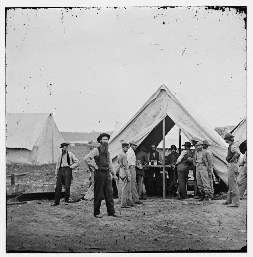 Men mill about a sutler's tent in the camp of the Second Division, IX Corps, Army of the Potomac during the Siege of Petersburg in November 1864.