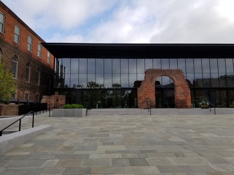 The new museum building is located among the ruins of Tredegar Iron Works, which was essential for the Confederacy’s heavy ordnance and munitions production. Visitors enter the building by walking through the brick archway and past preserved remnants of Tredegar’s mills and foundries. 