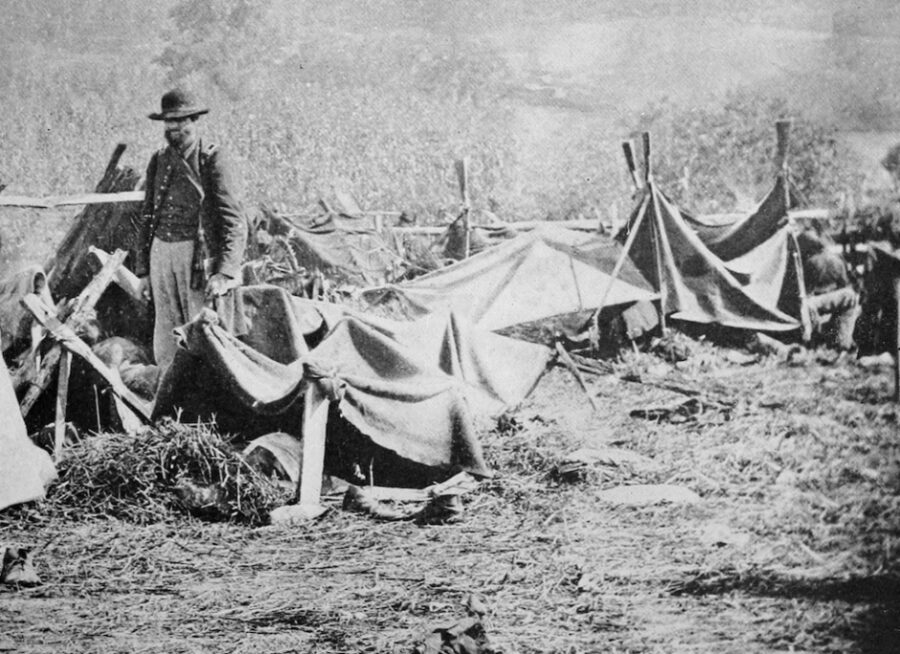 Shelter tents put up by Union captives litter the grounds of Andersonville Prison in this image from August 1864.