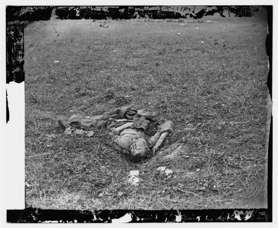 Confederate soldier, who, after being wounded, had dragged himself to a little ravine on the hill-side, where he died
