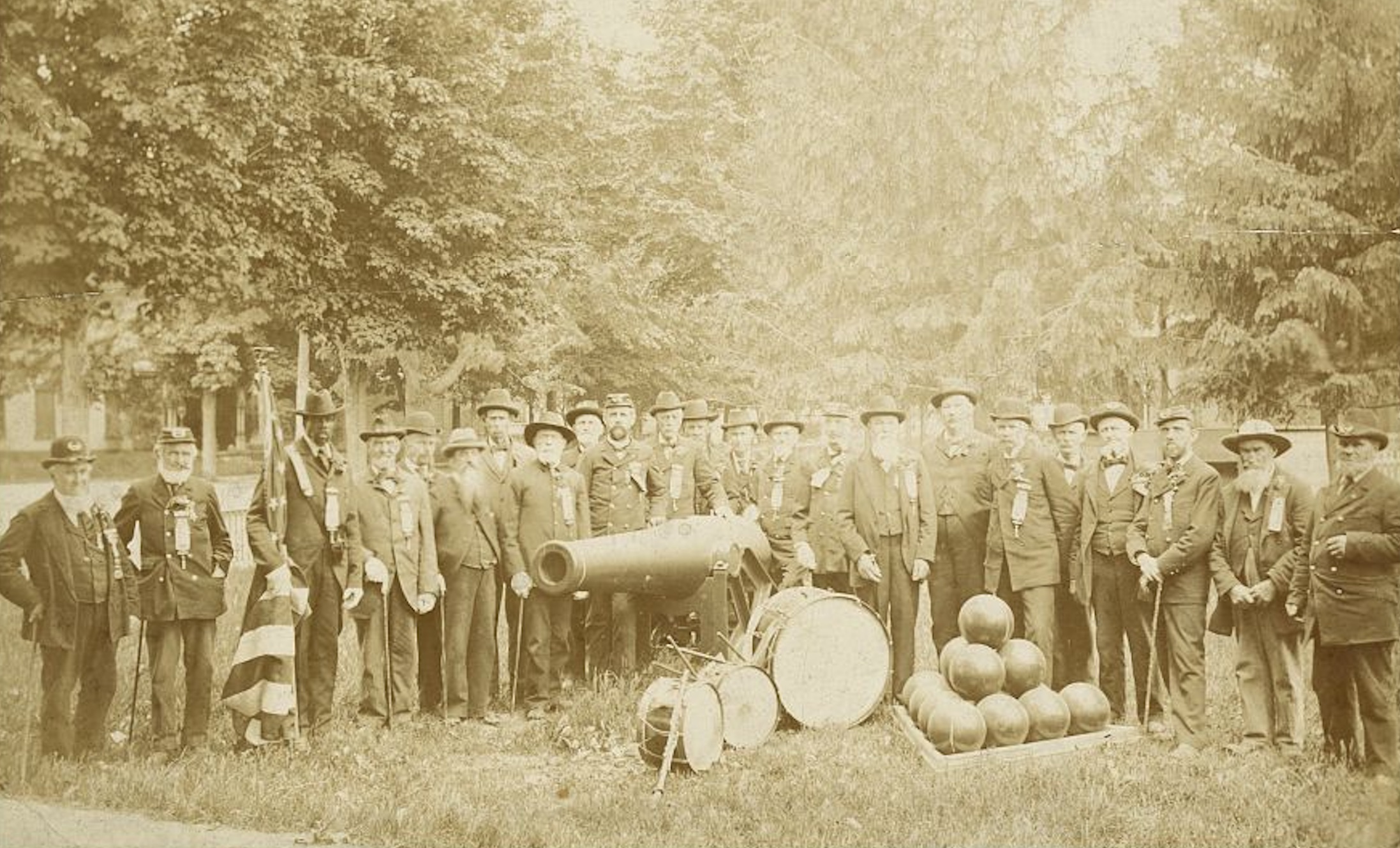 An African-American veteran holds the American flag at a regimental reunion held in Norwich, New York, in May 1897.