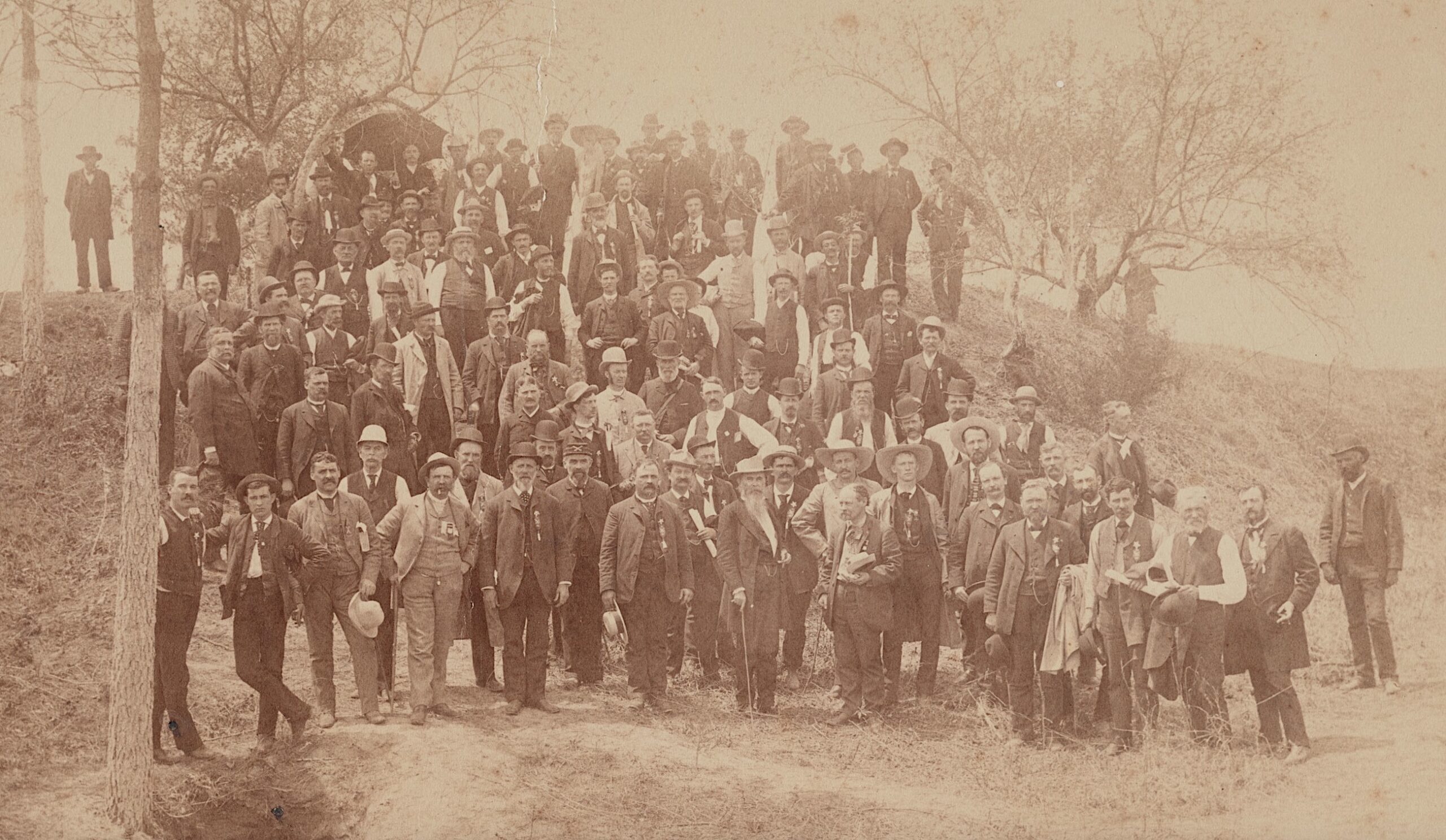 In this 1887 image, veterans of the 57th Massachusetts Infantry gather with former Confederate general William Mahome at the site of the Battle of the Crater at Petersburg, Virginia, in 1864.
