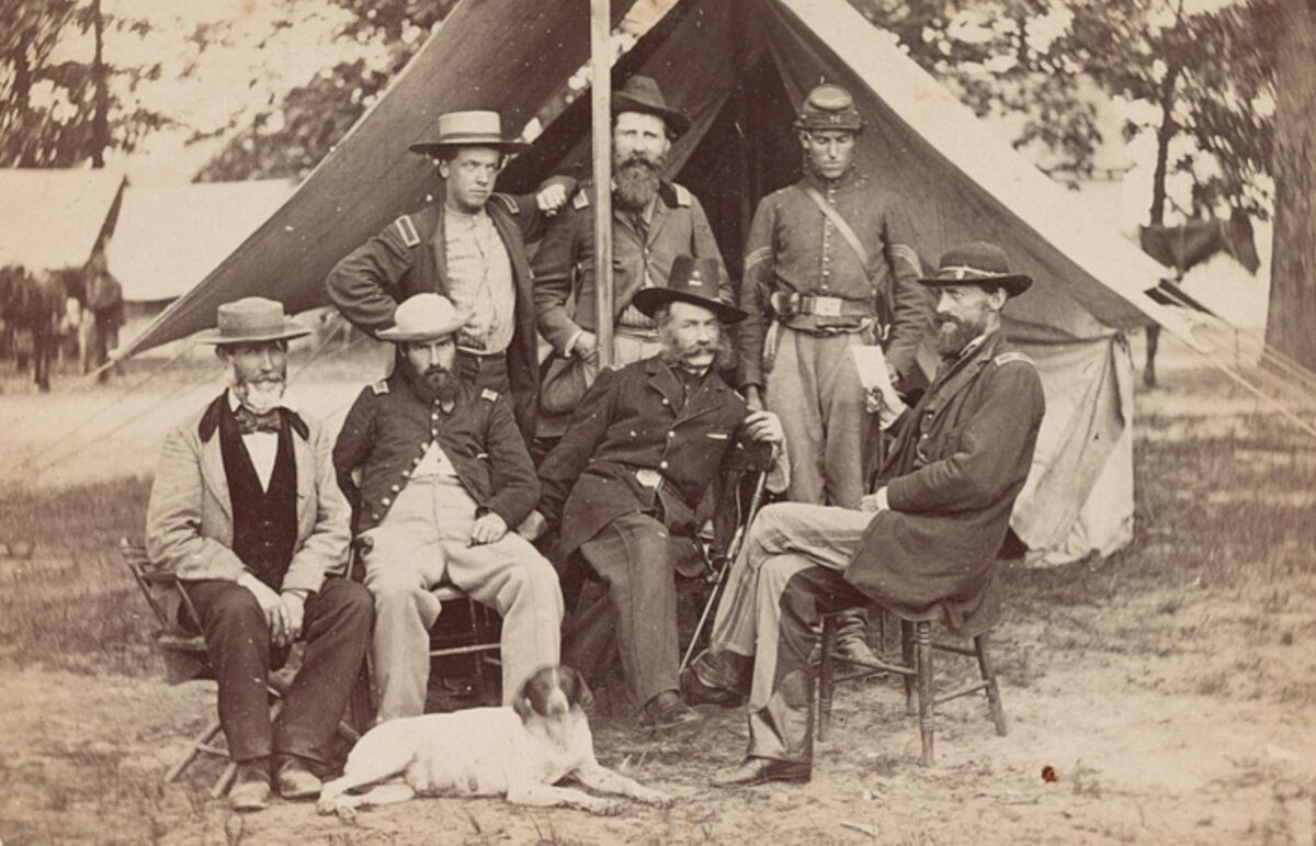 Union officers—and a pet dog—are shown in camp in a photograph made in 1862.