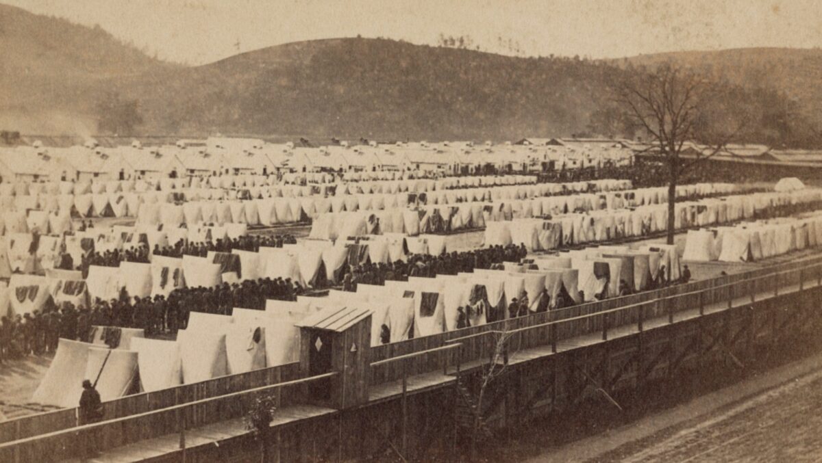 Confederate POWs are visible in this late-war photograph of the prison camp at Elmira, New York.