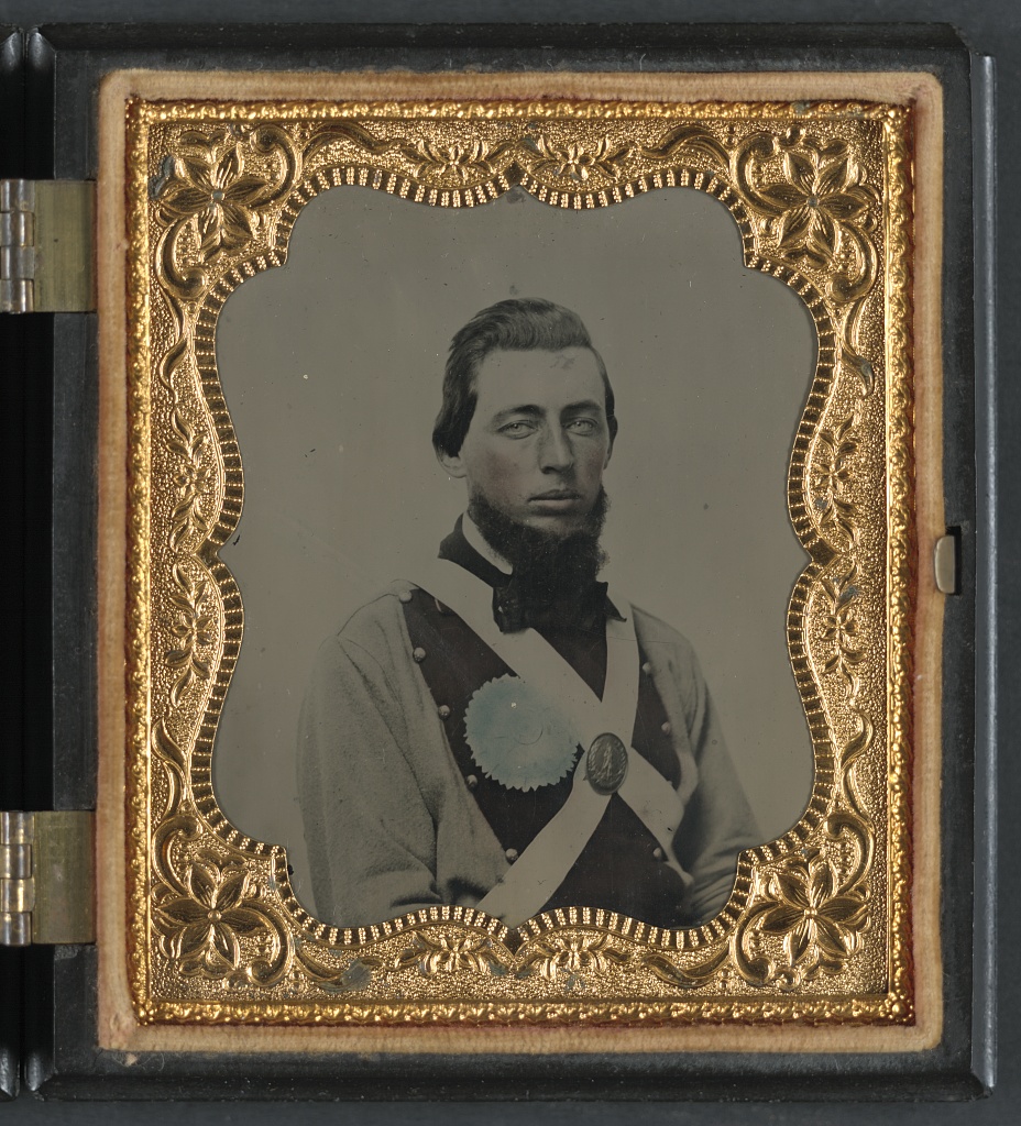 Private Peter S. Arthur of Company B, 11th Virginia Infantry Regiment, in uniform with secession badge and Virginia state seal breastplate