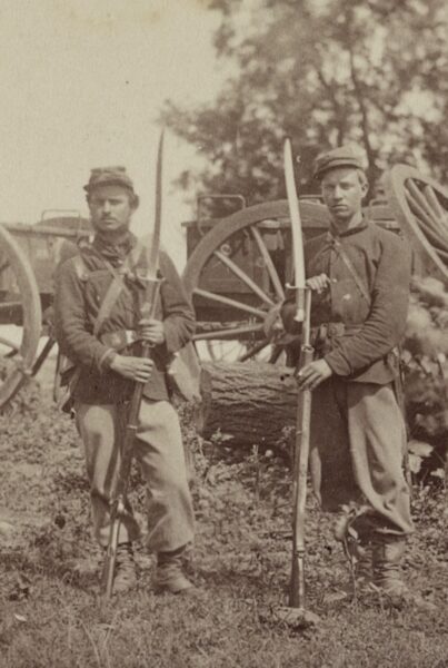Union soldiers pose with their bayonetted rifles in a photo made in 1861.