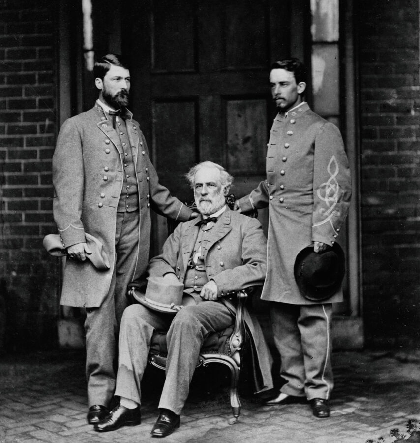 George Washington Custis Lee stands beside his father, General Robert E. Lee, and his father’s aide, Walter Taylor.