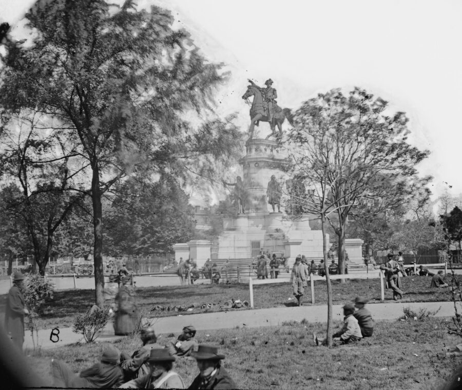 Union soldiers mingle with Confederate parolees at the Washington Monument next to the Capitol in Richmond, Virginia.