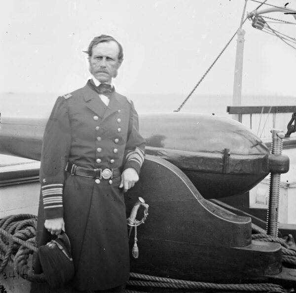 John Dahlgren standing next to a 50-pound Dahlgren rifle in 1865.