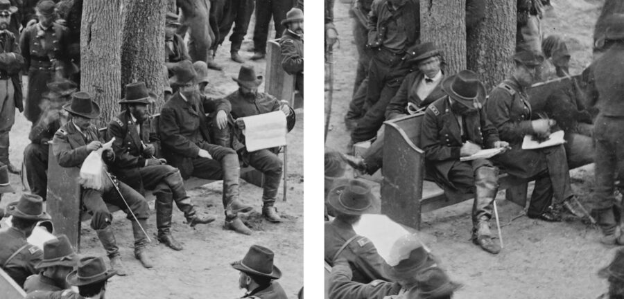 Ulysses S. Grant smokes a cigar while sitting among other soldiers.