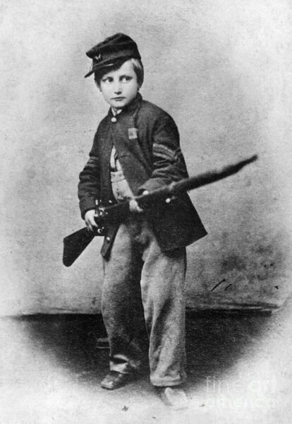 Johnny Clem holding rifle