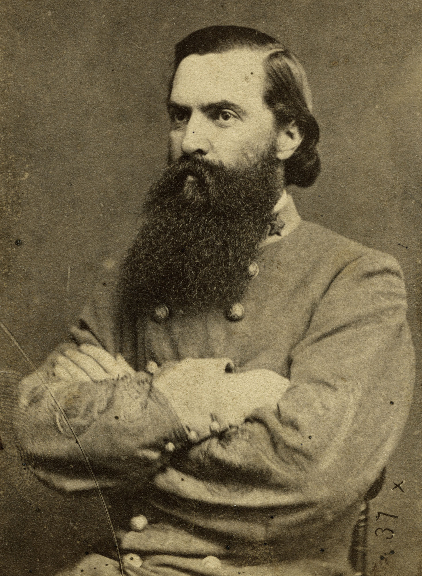 Large portrait of William Gaston Delony, Lieutenant Colonel, Cobb's Legion Cavalry, bearded Confederate officer with arms crossed.