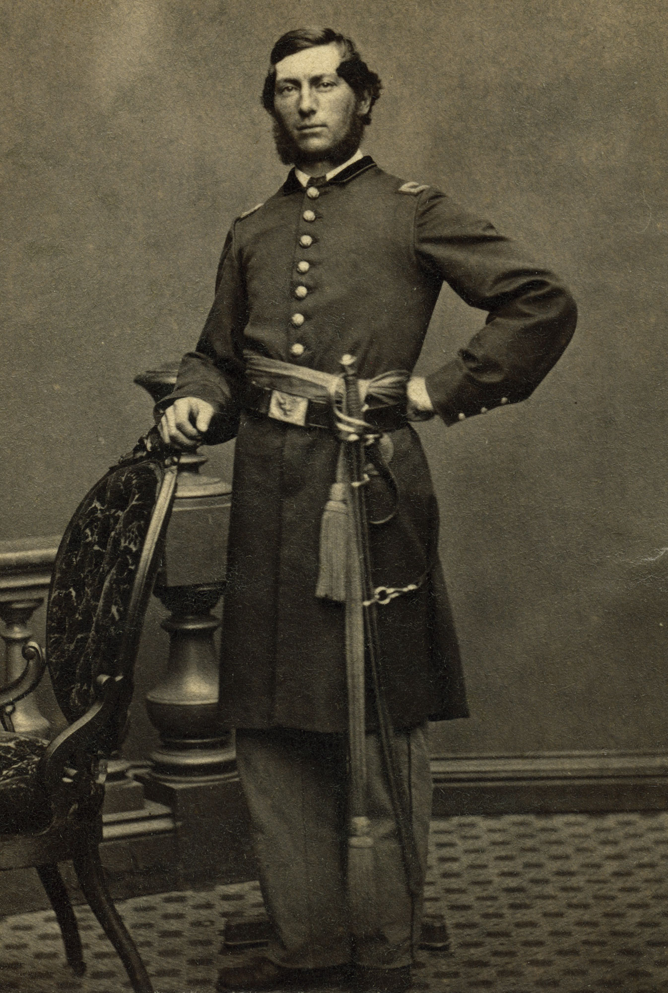Large portrait of William H. Rogers, 2nd Lieutenant, 6th Maine Light Artillery, standing in uniform with sword.