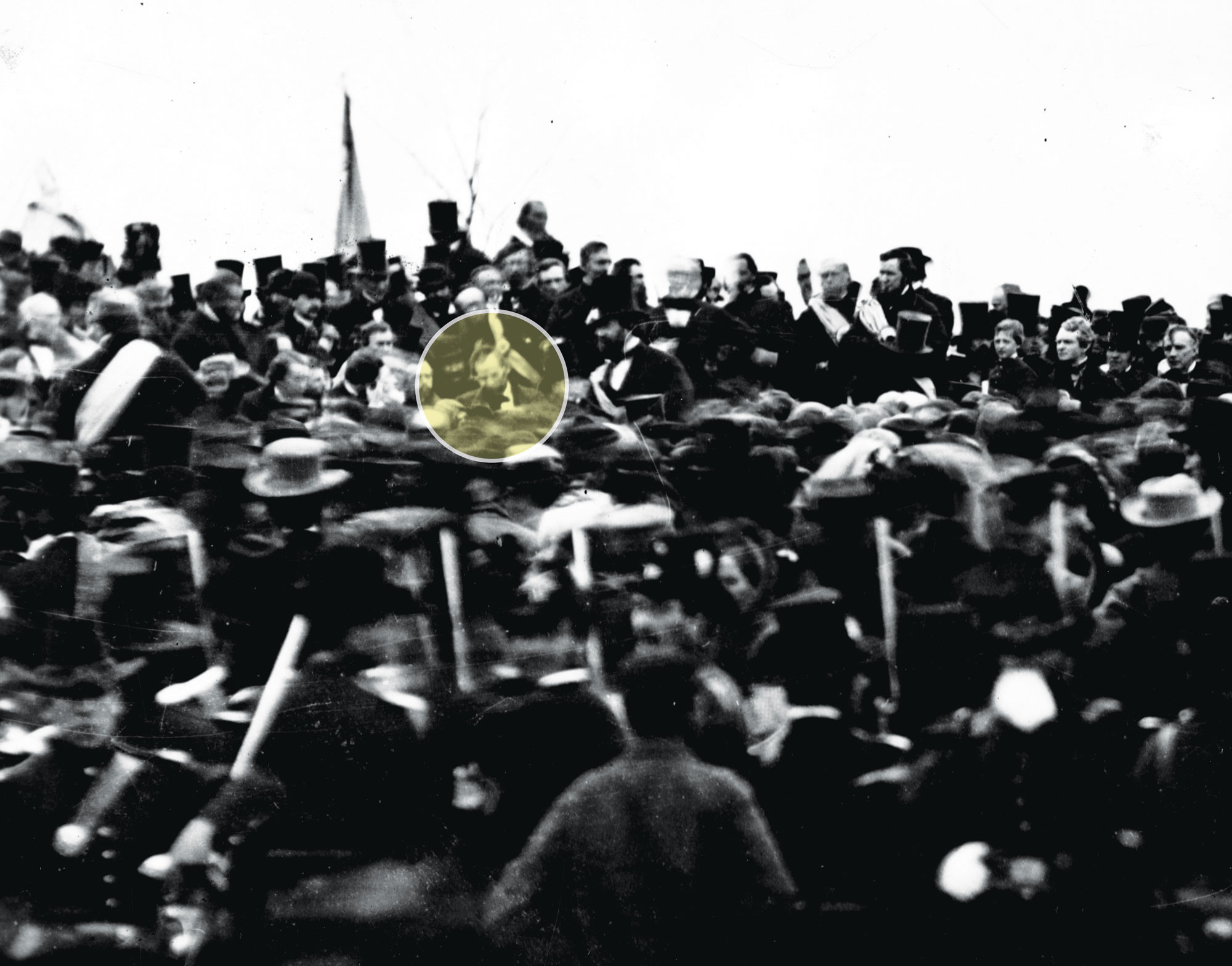 Black and white photograph of a large crowd at the Gettysburg dedication ceremony, with Lincoln highlighted in a yellow circle