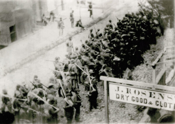 Column of Confederate infantrymen on a street in Frederick, Maryland.