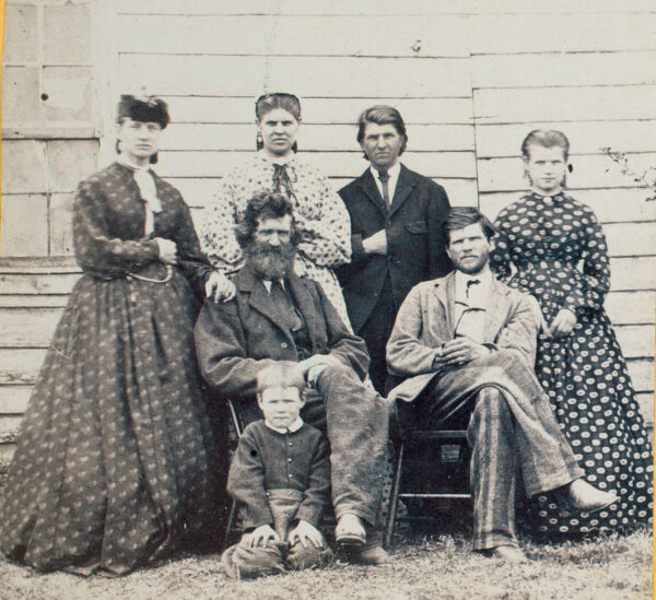 Rev. Melzi S. Chancellor and six members of his family outside Dowdall’s Tavern in 1866.