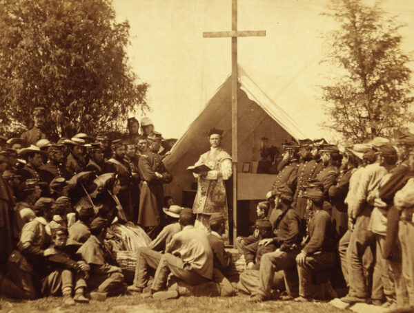 Civil War chaplain holds service at camp.